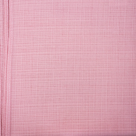 Close-up of pink textured fabric with a subtle pattern