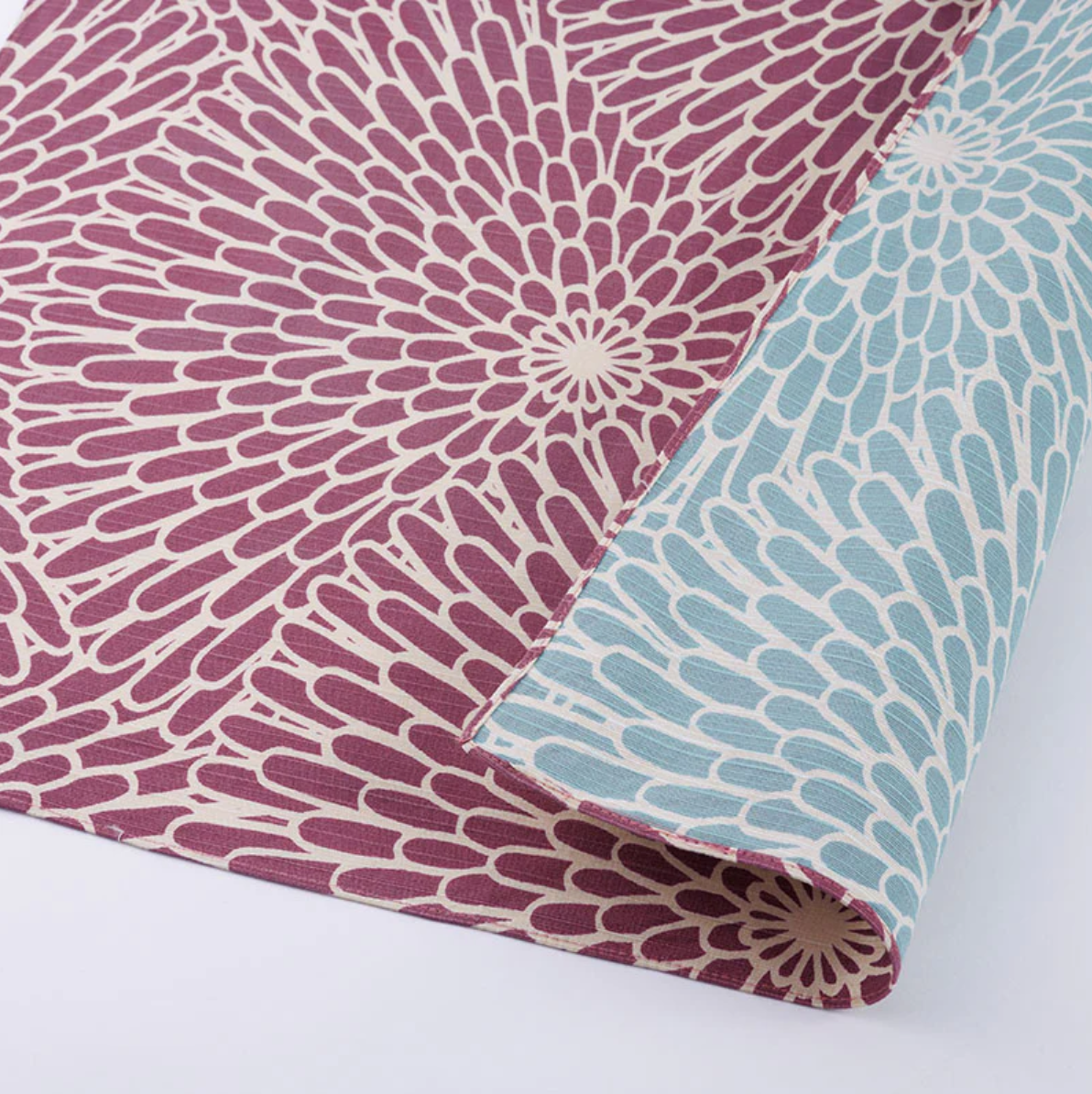 Close-up of a furoshiki cloth with blue and purple chrysanthemum pattern