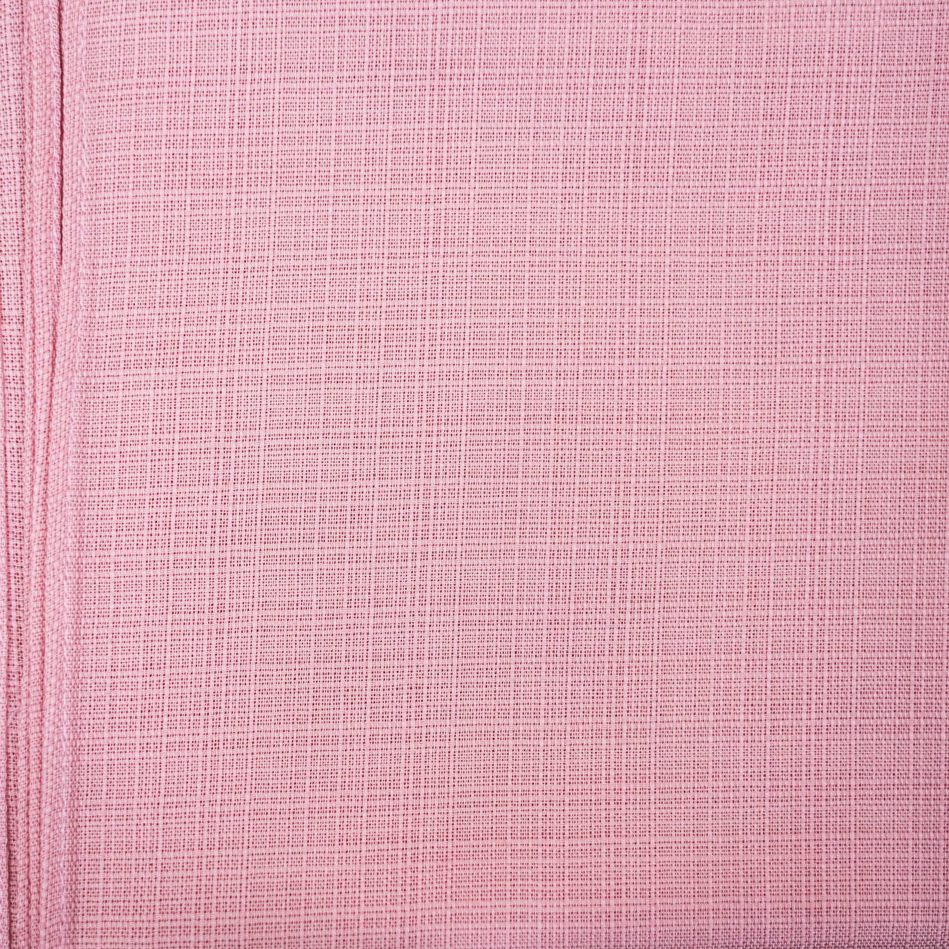 Close-up of pink textured fabric with a subtle pattern